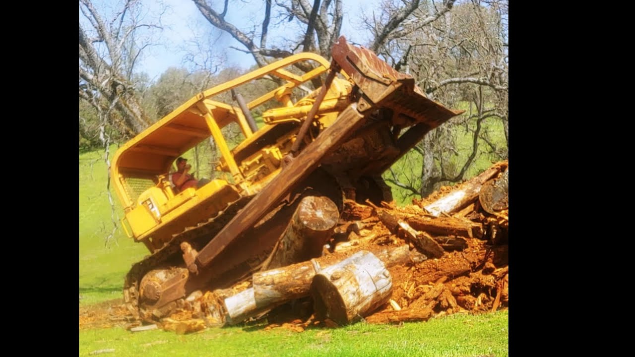 Caterpillar D8H, repairs and busting up some rotten wood