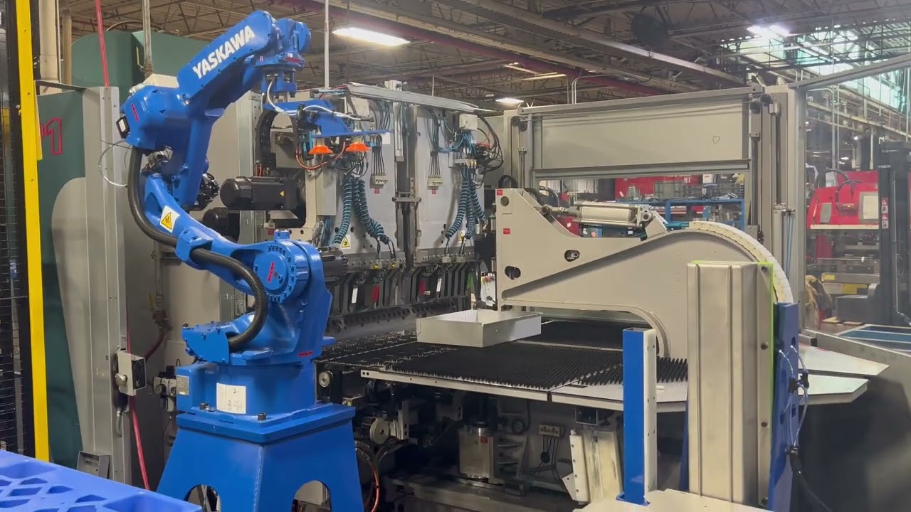 Robotic tending of a sheet metal parts folder press with a Yaskawa GP12 robot