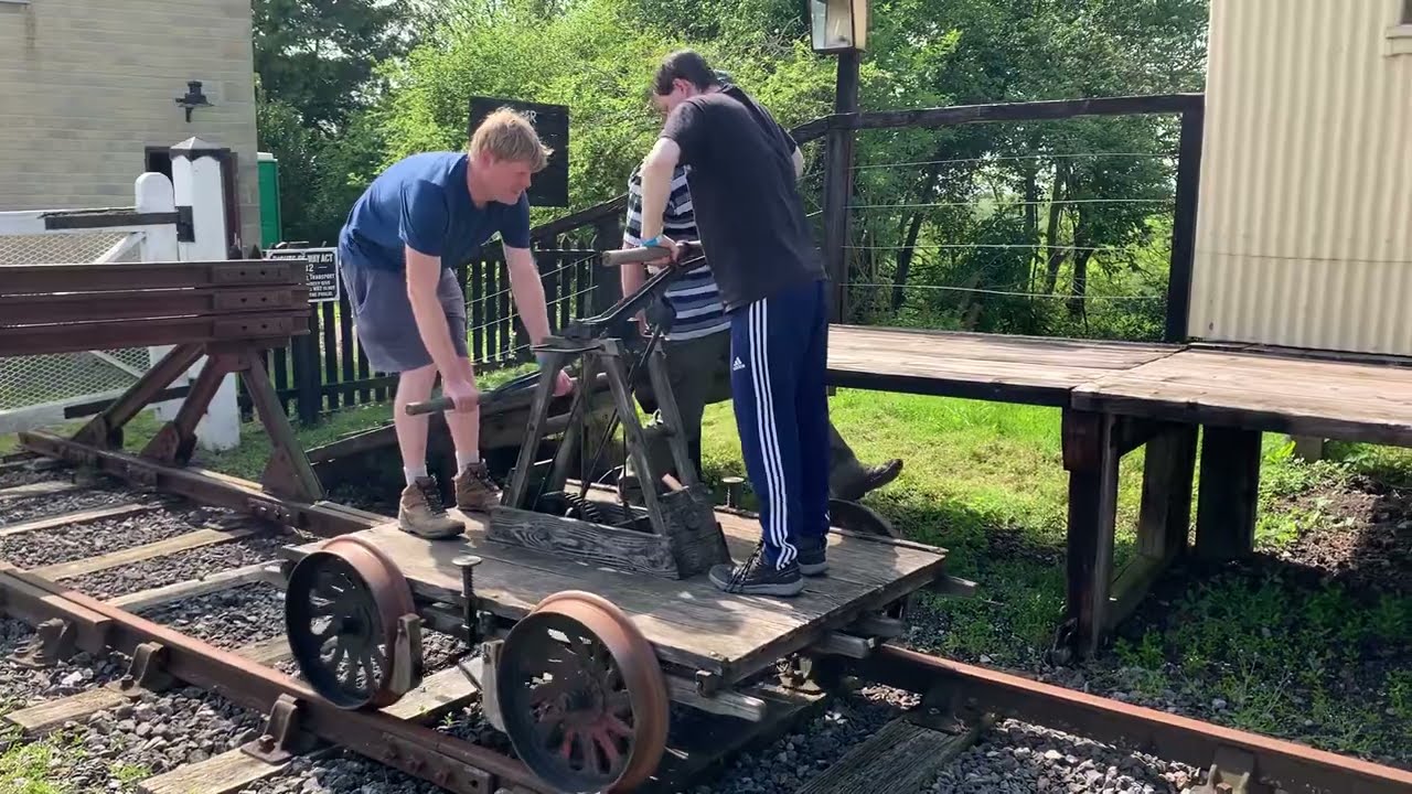 Enjoying using a vintage hand pump trolley railway wagon