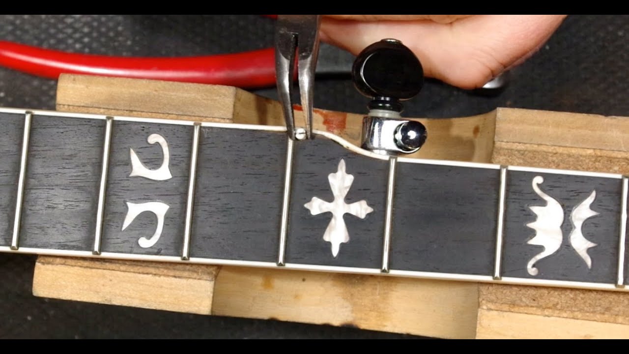 relocating a fifth string nut