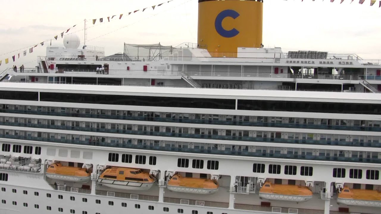 Costa Mediterranea passing Costa Concordia - Port of Barcelona.