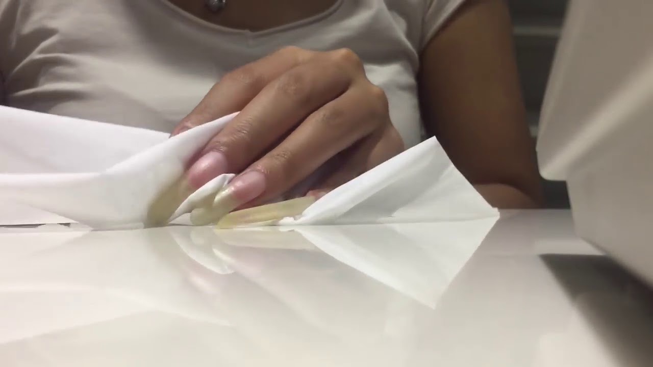 Tang Tang playing with paper using her bare long nails (video 17)