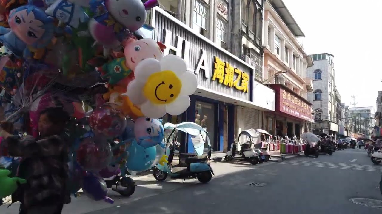 4K The Chinese border city of Dongxing, bordering Vietnam.Bicycle Tour GuangXi FangChengGang port