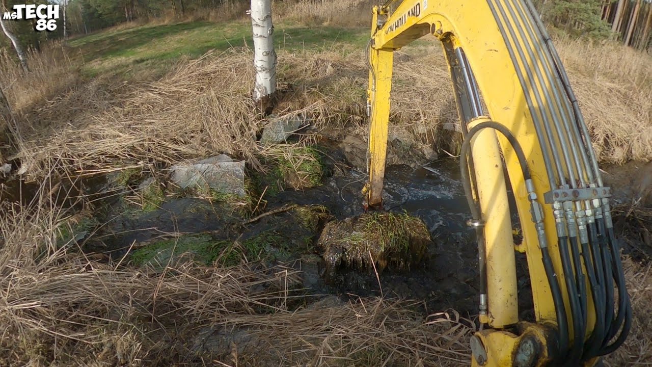 Clearing The Blockage On The Stream And Desludging The Ditch With The Excavator