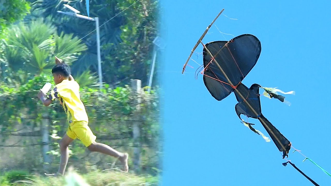 The farmer boys made a strange kite to fly hide in field for entertainment.