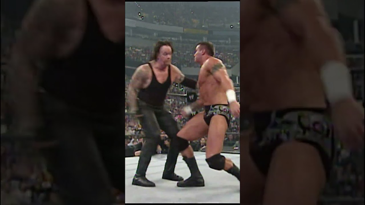 Undertaker suddenly executes a MASSIVE big boot on a stunned Randy Orton