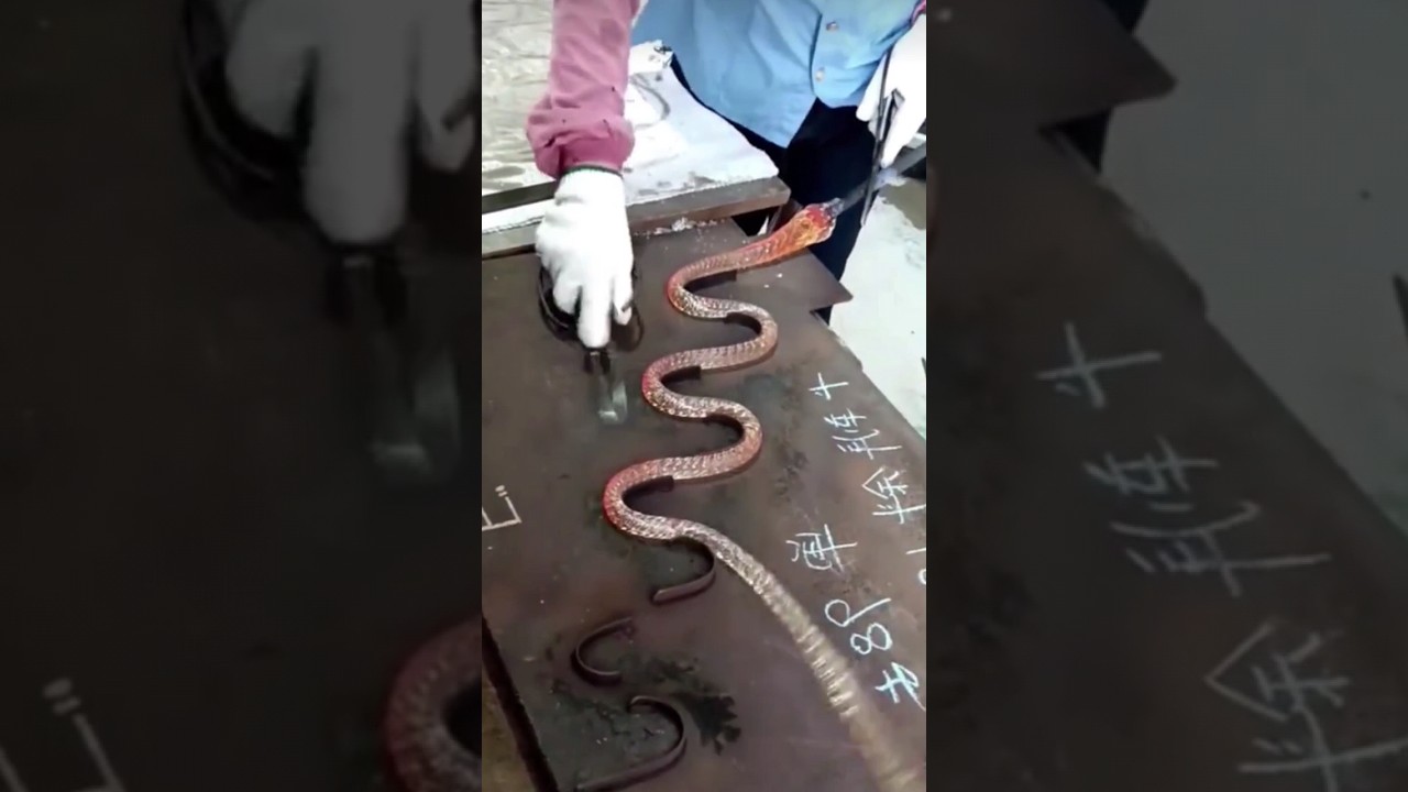 The process of forming a figured glass product in the form of a snake