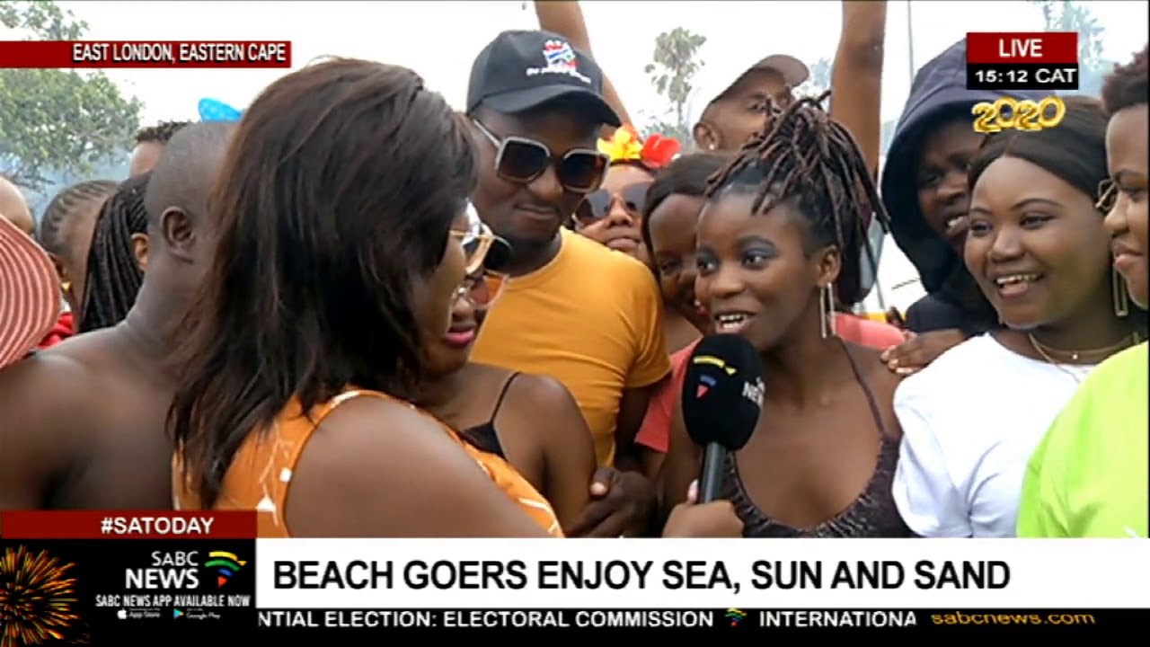New Year Celebrations I East London beachgoers enjoy sun, sea and sand
