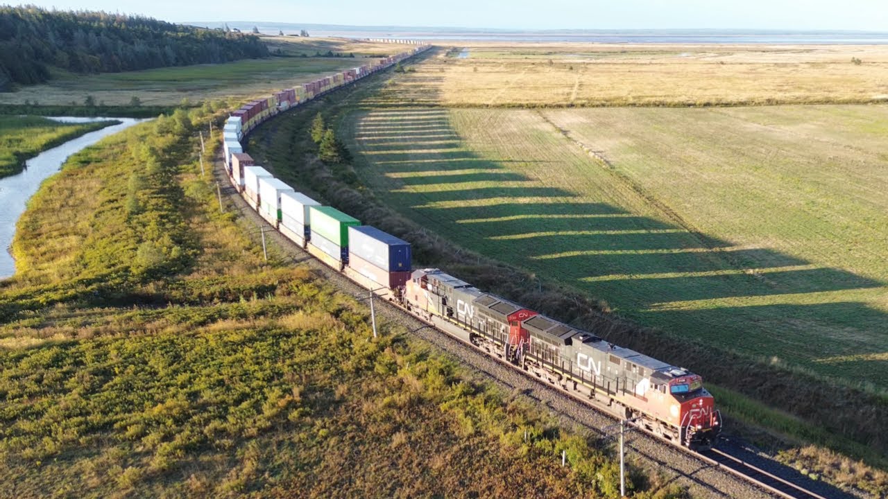 Awesome Golden Hour Aerial 4K View! Long Extra Stack Train CN X121 Rounding the Bend at Aulac, NB