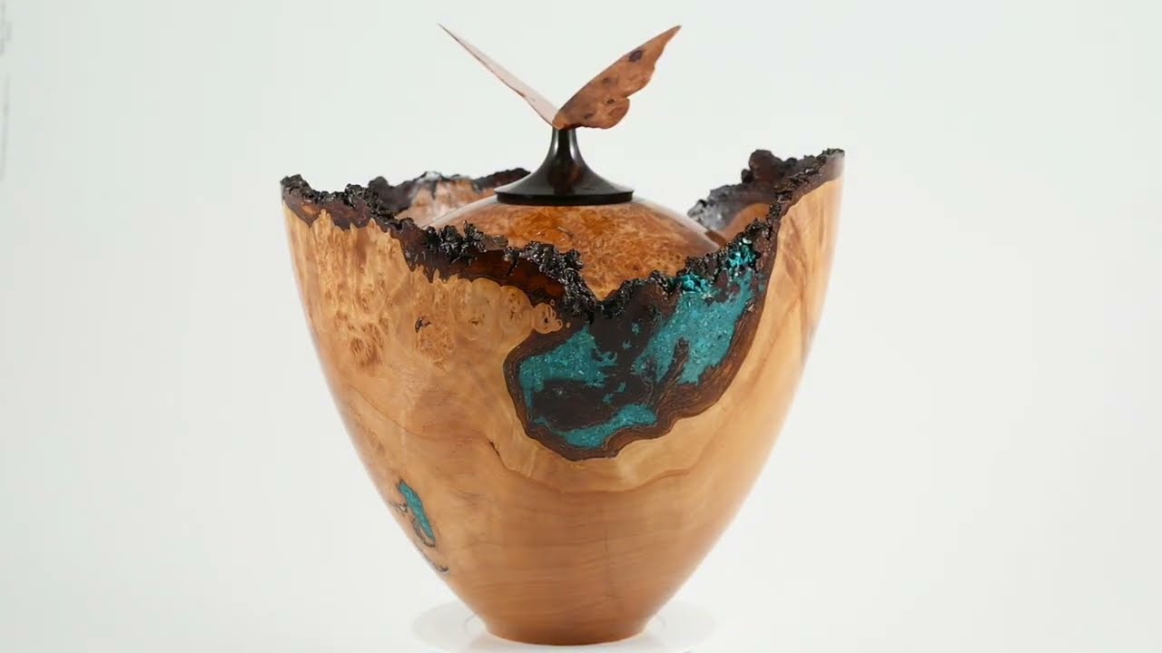 Large handmade wooden urn of Alder burl with a butterfly of Cherry burl on top