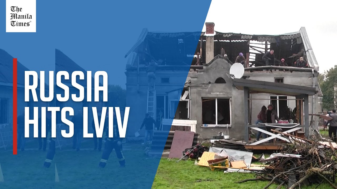 Rescuers and residents clear debris after deadly Russian strikes hit Lviv