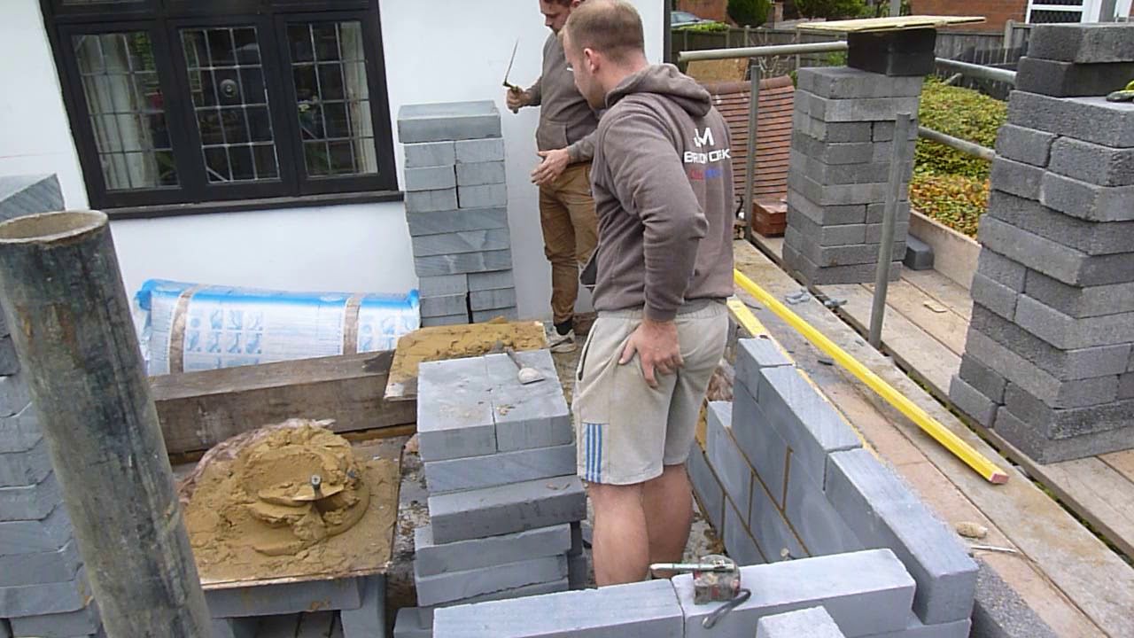 Laying blocks on the second floor.