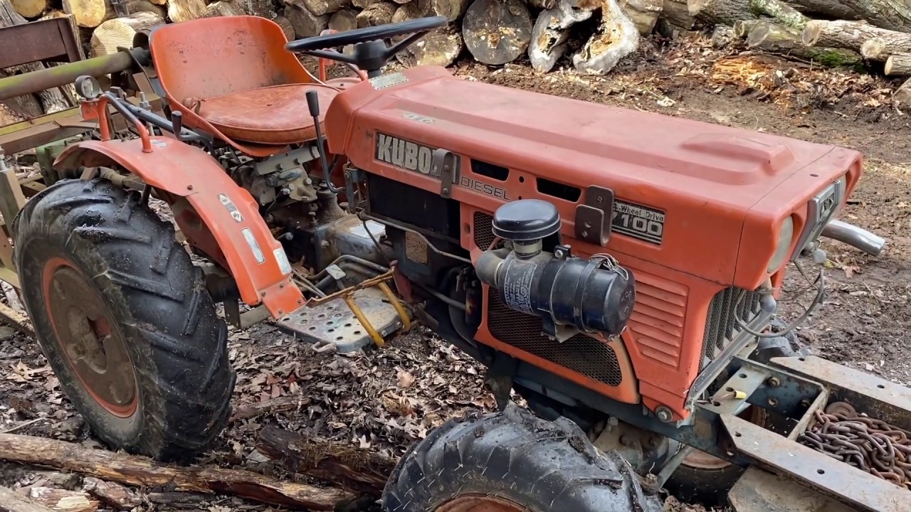 Kubota B7100, циркулярная пила и штанга для резки древесины
