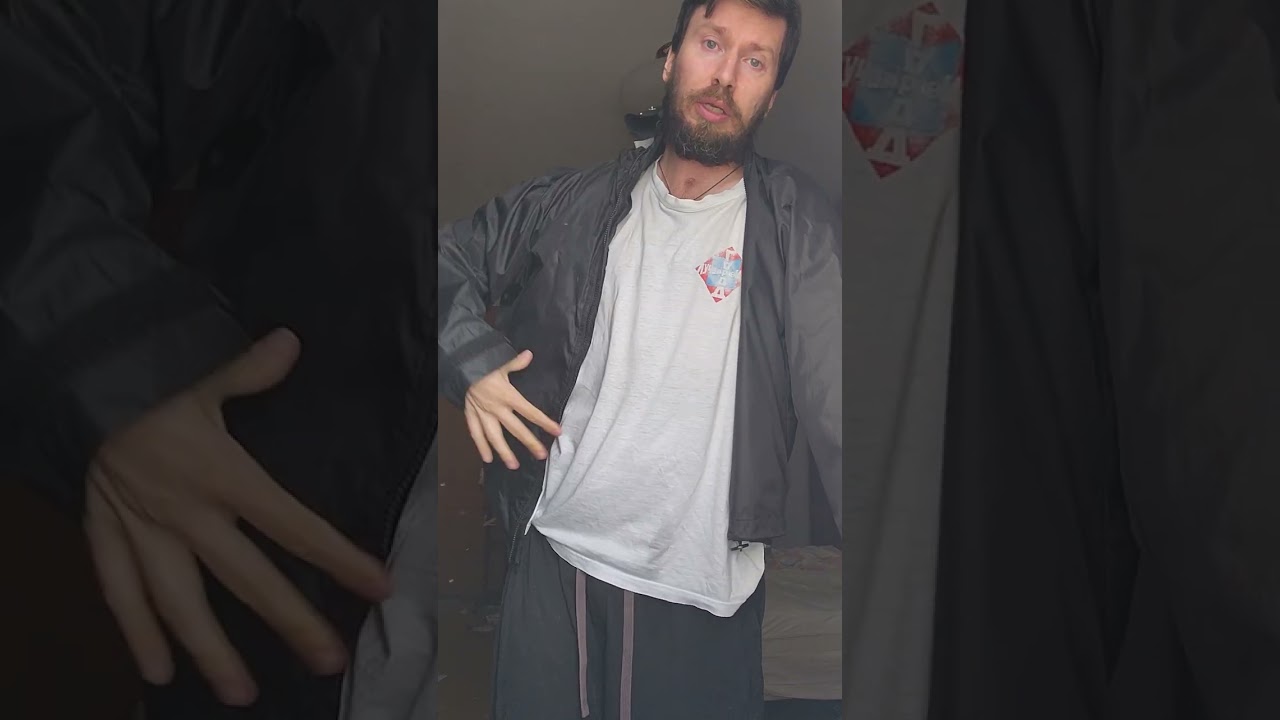 put on coat and zip it with one hand
