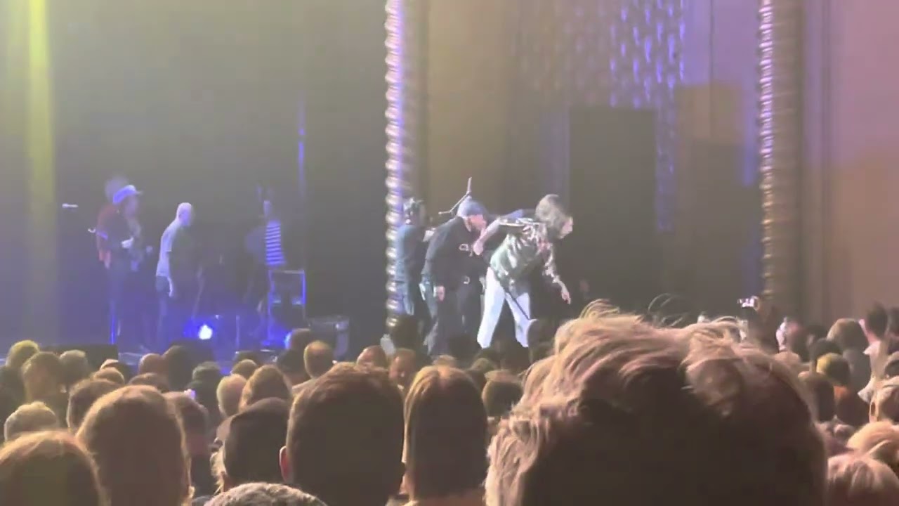 The Black Crowes stage invader cops it with microphone stand & guitar Palais Theatre Melbourne