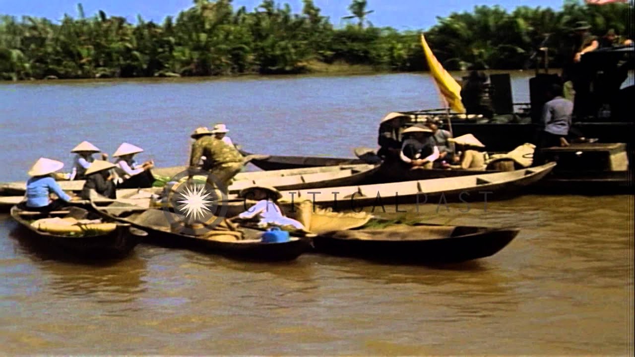 A crewman aboard a PBR  inspects Vietnamese on the sampans during Operation Giant...HD Stock Footage