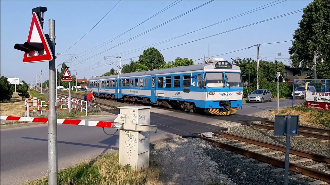 HZPP Croatia trains (HŽ Putnički prijevoz) in Culinec Station (near Zagreb), railway crossing