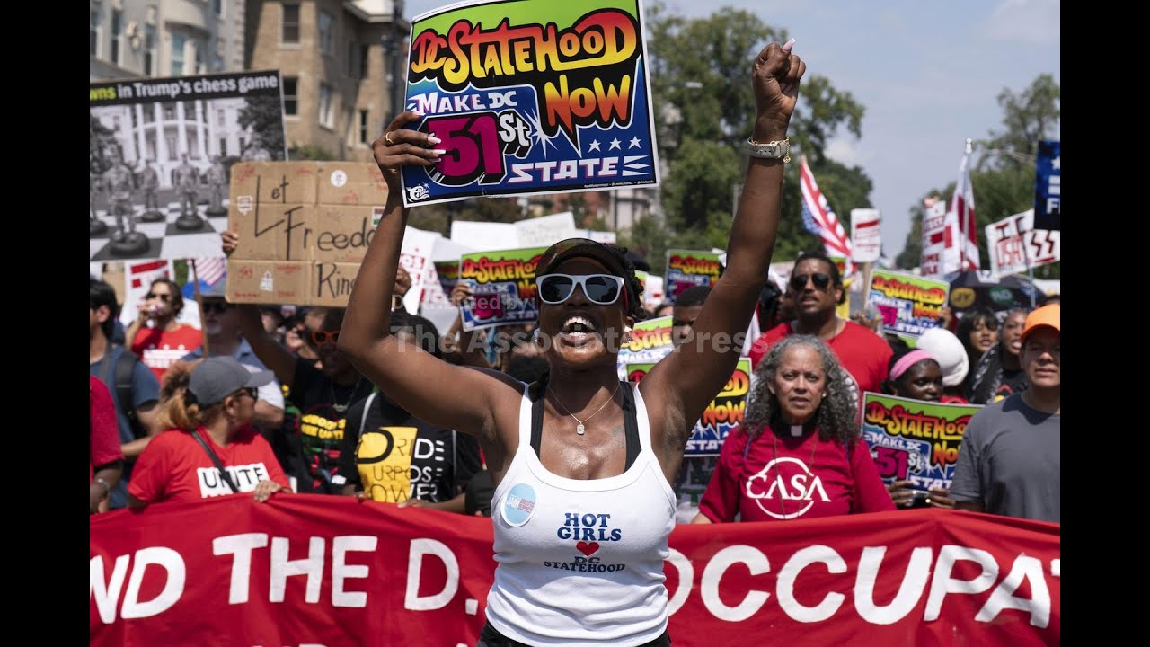 Thousands protest for a 'Free DC' on the fourth week of federal control in Washington