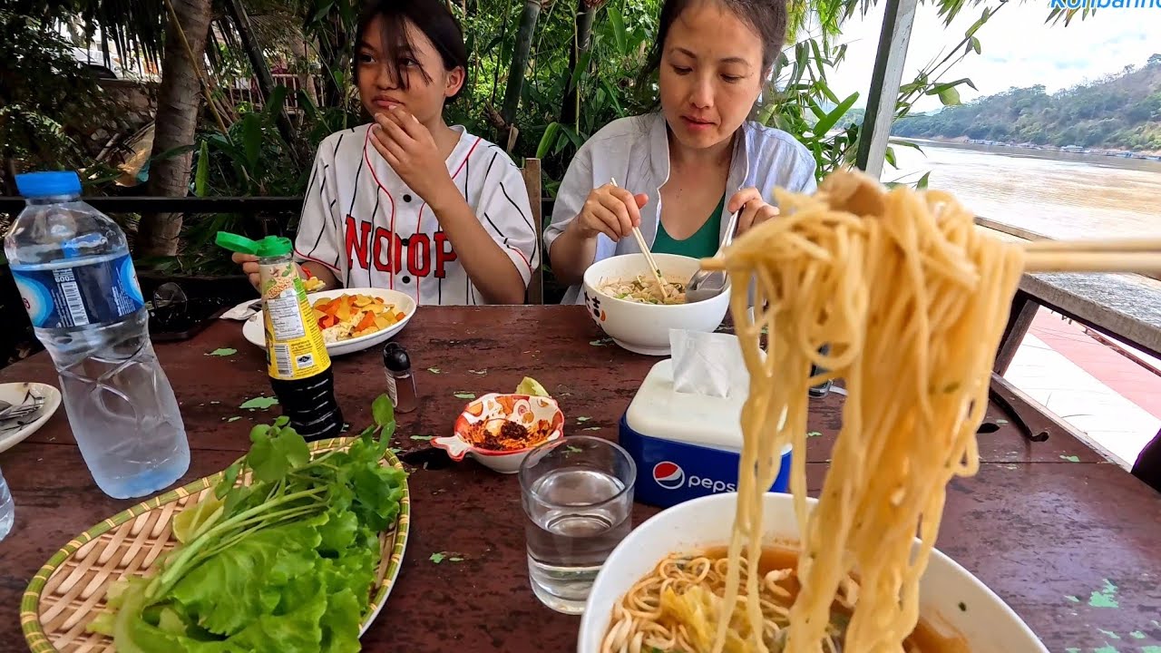 It's affordable and beautiful to stay in Luang Prabang, Laos. Eating food by Mekong riverside.