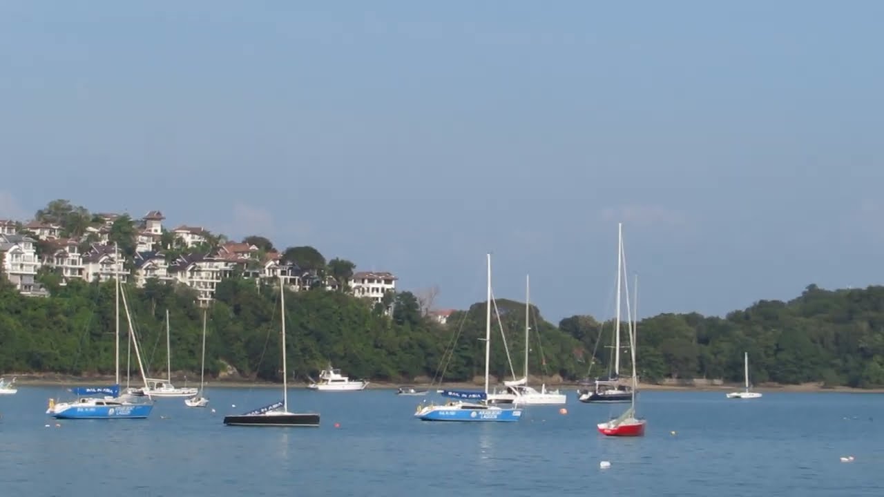AO YON PHUKET BEACH THAILAND BOATS AND HILL TOP HOUSES 2020