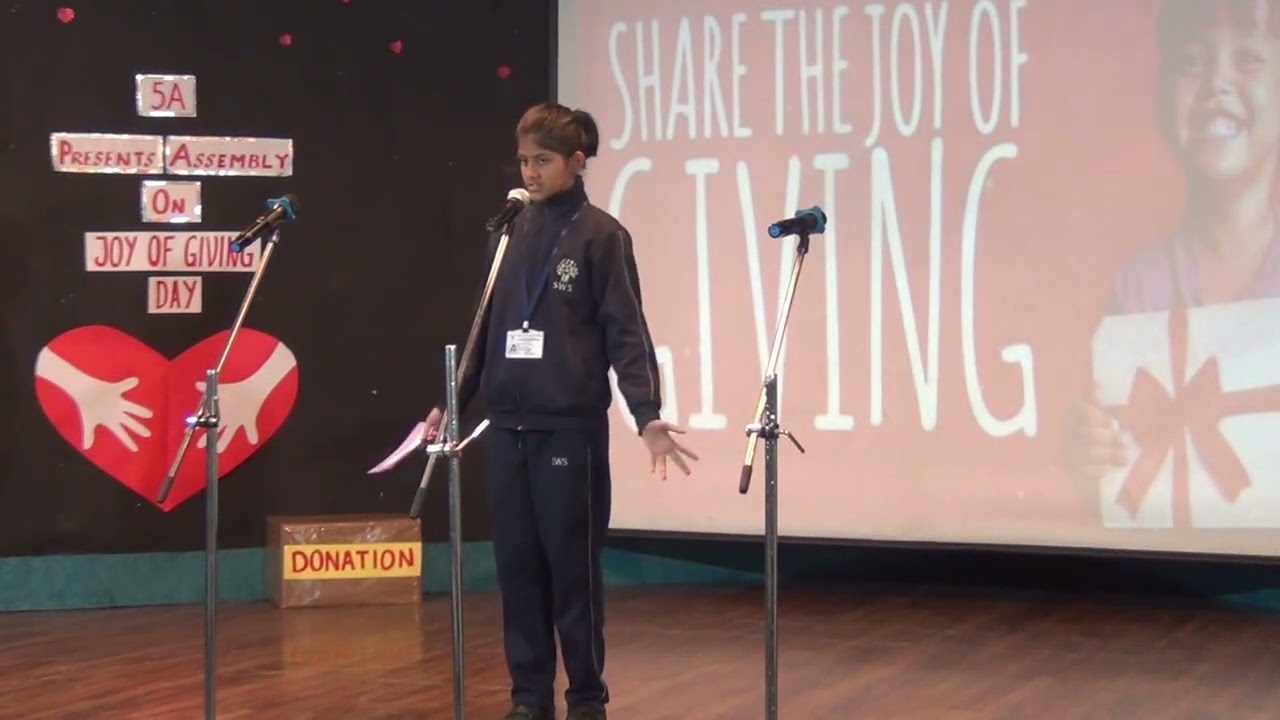 Assembly of Joy of Giving by Class 5 A