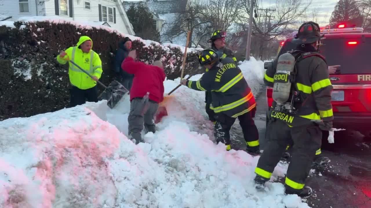 Firefighters dig out fire hydrants in Watertown
