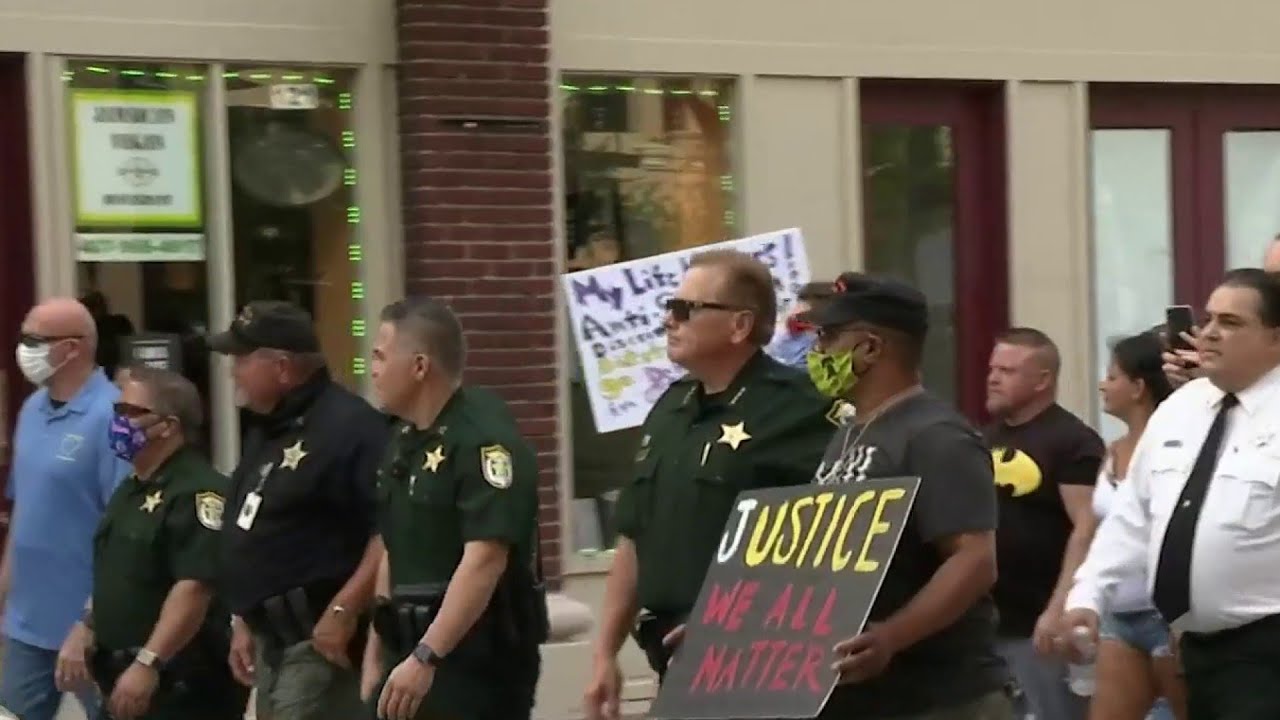 Police join protesters in March for Justice in Kissimmee