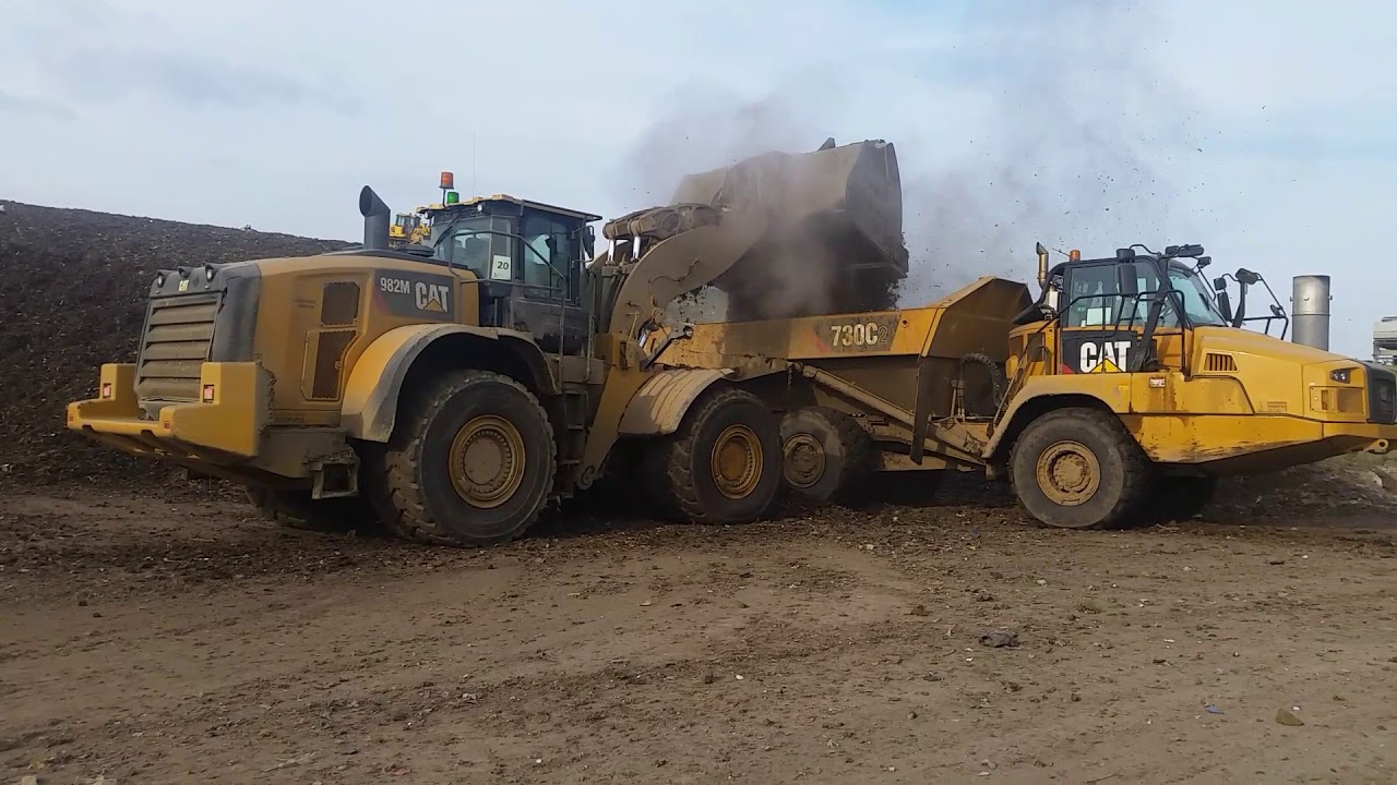 Caterpillar 982m Front end Loader and Cat 730c dump truck