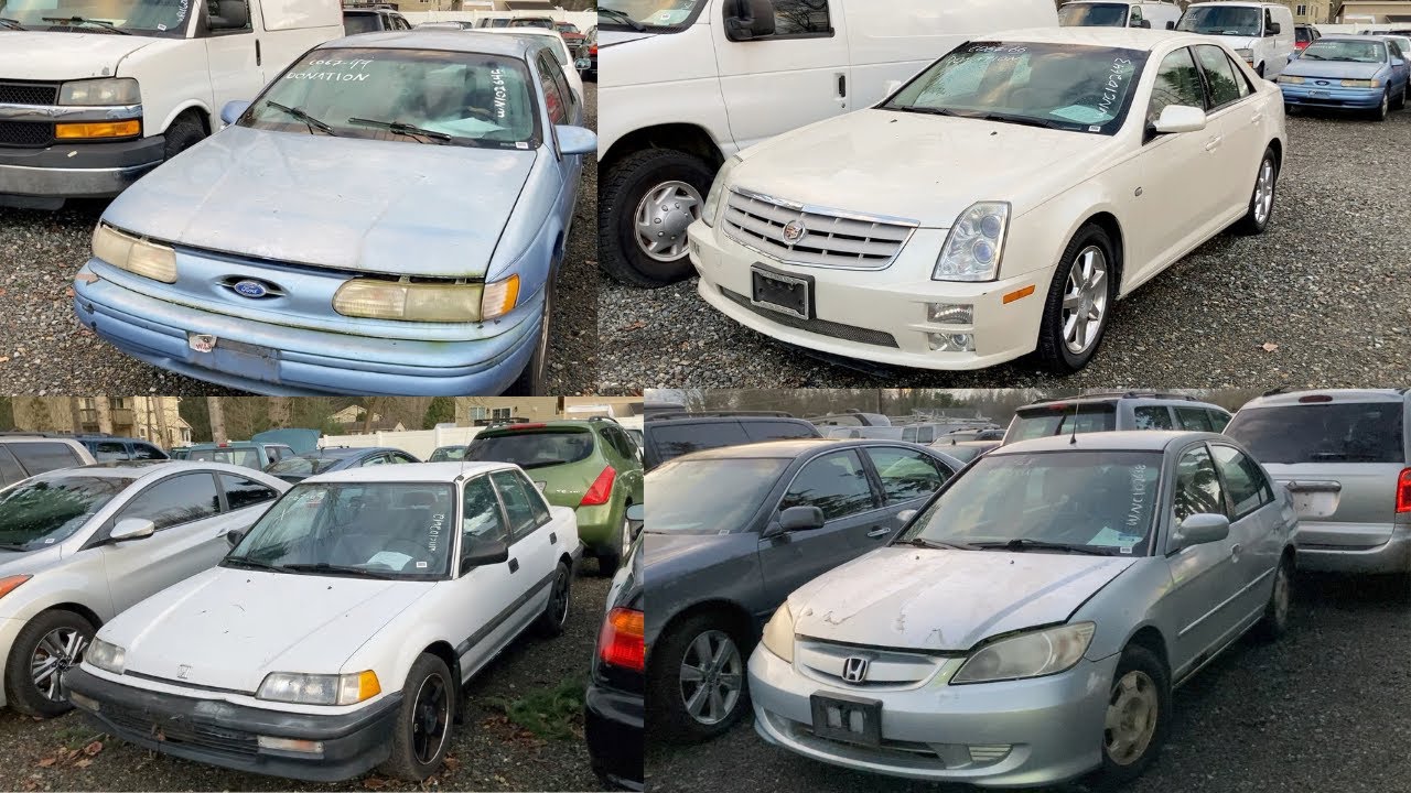 Walking The Auction: A tired Taurus, a beautiful Cadillac, Old school Civic, and a Rusty Hybrid.
