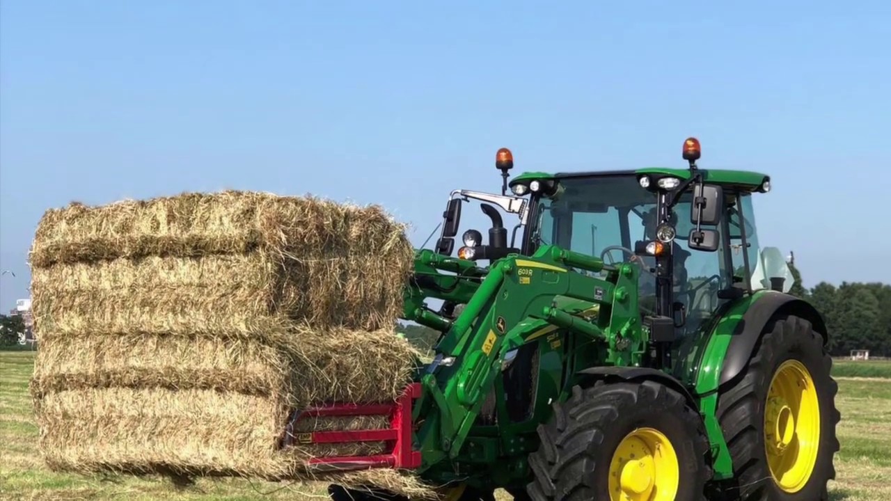 John Deere 5125R 603R hauling hay bales