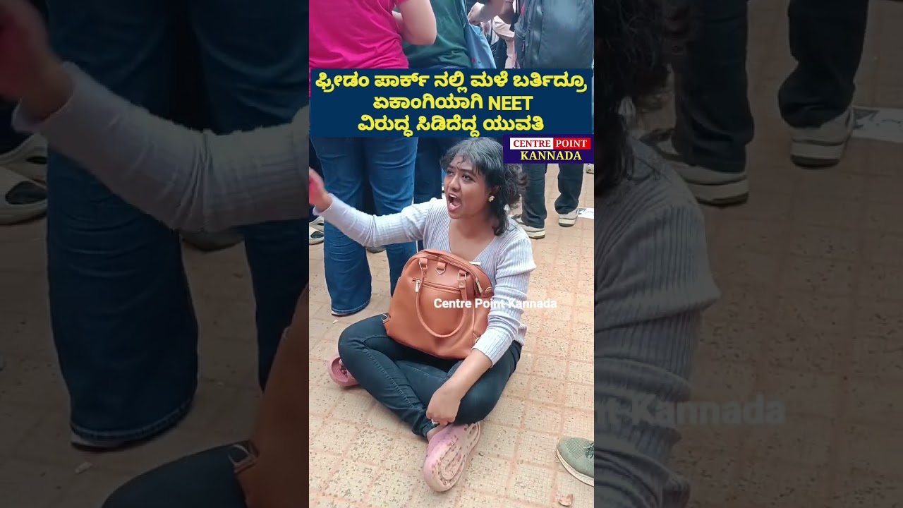 Young Woman Stands Alone Against NEET at Freedom Park Despite the Rain