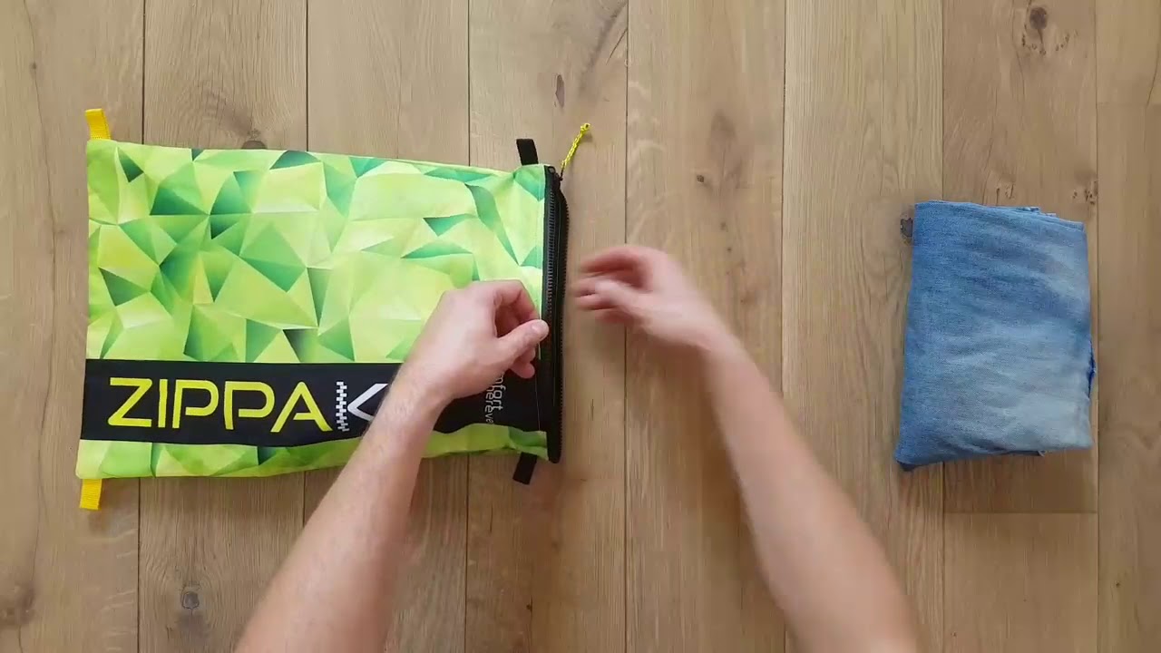 Jak zapakować ubrania do saszetki podr&oacute;żnej Zippak.