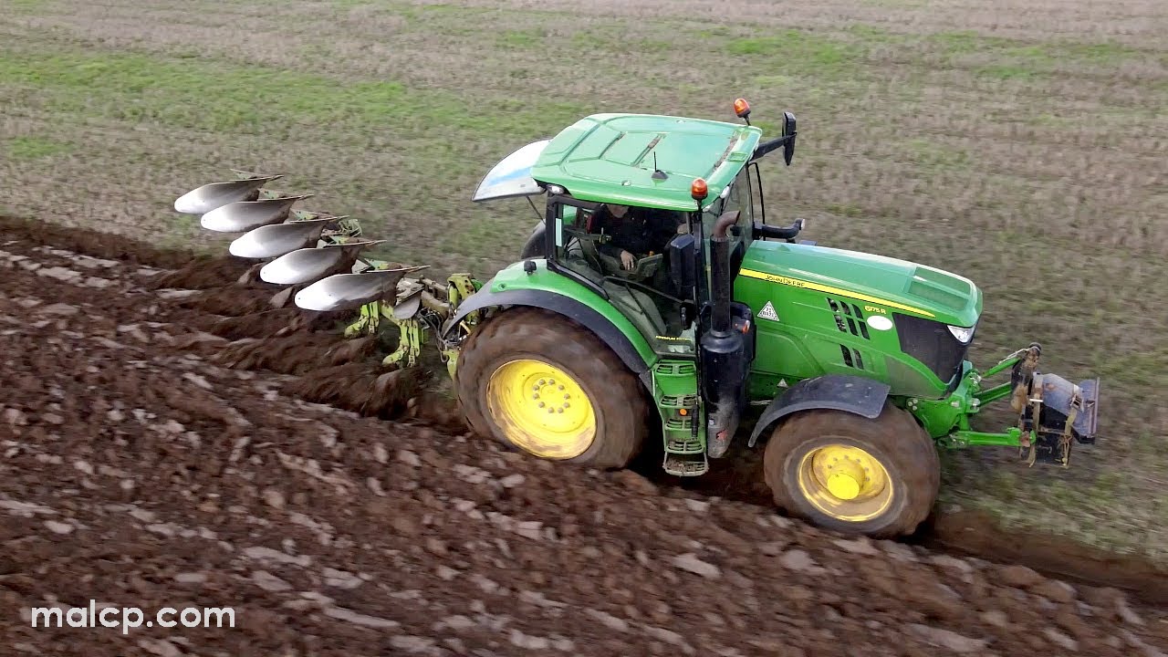 John Deere 6175R ploughing with a Dowdeswell five furrow plough in Little Glemham, Suffolk.