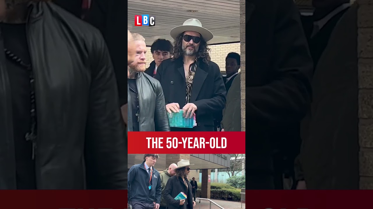 Russell Brand clutches Bible in court appearance