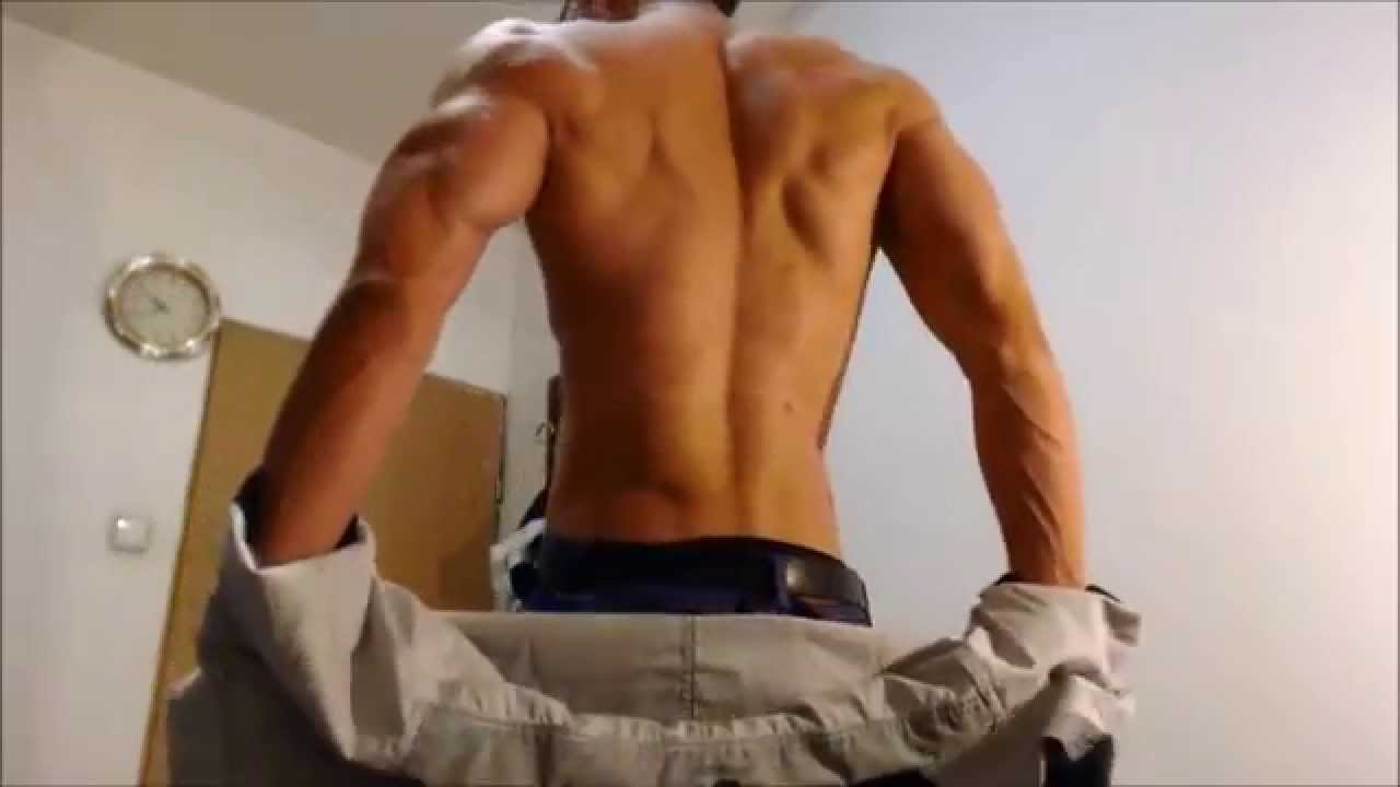 Muscular man strip dance