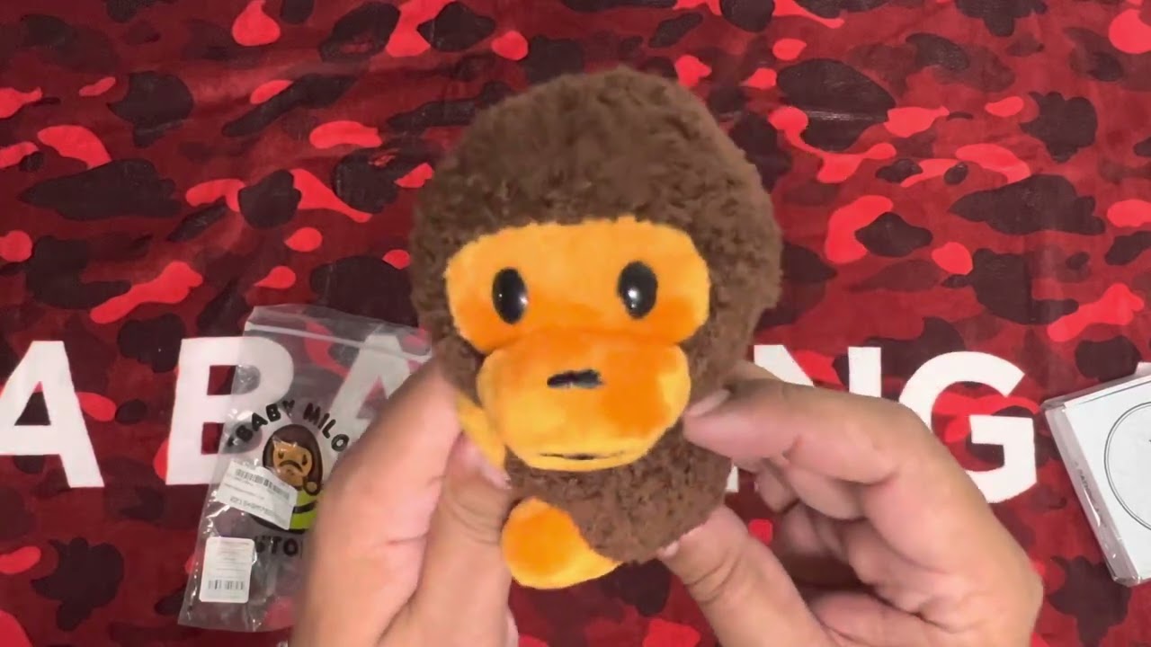 Bape : Green Camo ‘ABC’ Wireless Charger and Brown Sitting Milo Magnetic Plush Toy