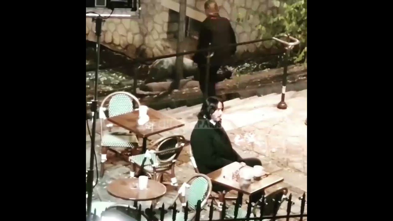 Keanu Reeves Relaxing On The Set Of John Wick 4 & Talking To Director Chad Stahelski