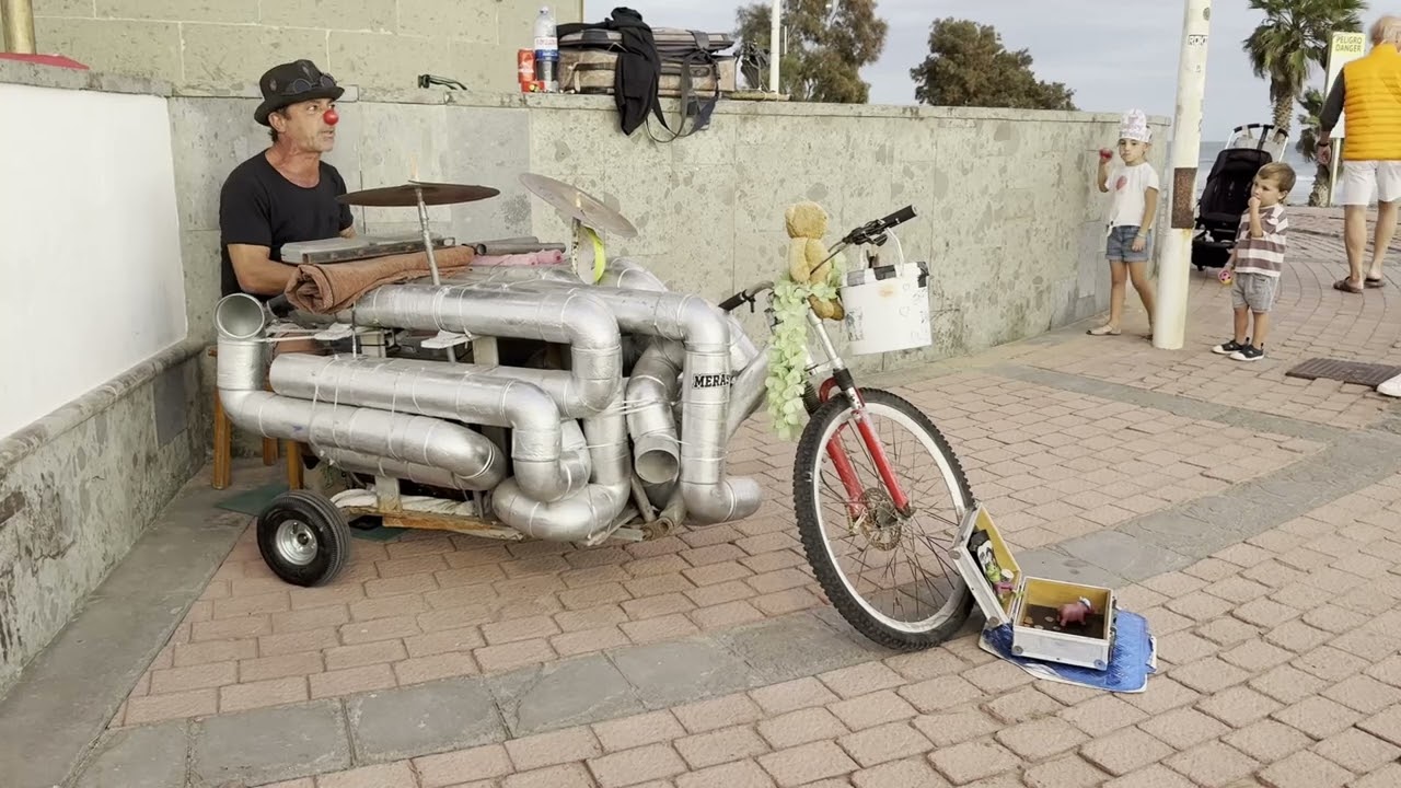 Street Music Magic: Pipe Drummer at Maspalomas Lighthouse 🎺🏝️