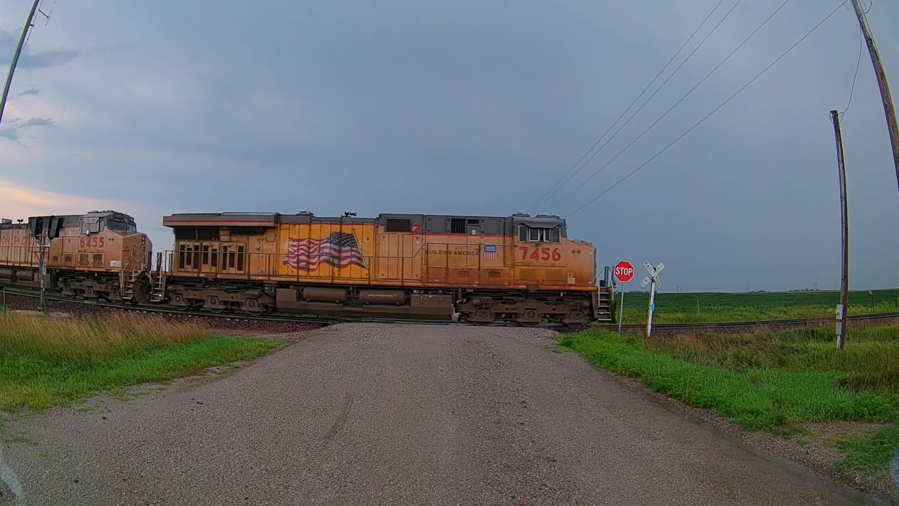 UP 6455 and UP 6239 with 128 freight cars in the rain on the Spine Line