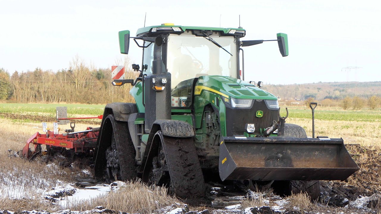 John Deere 8RX 410 clearing out Muddy Potholes with Väderstad Cultus HD425