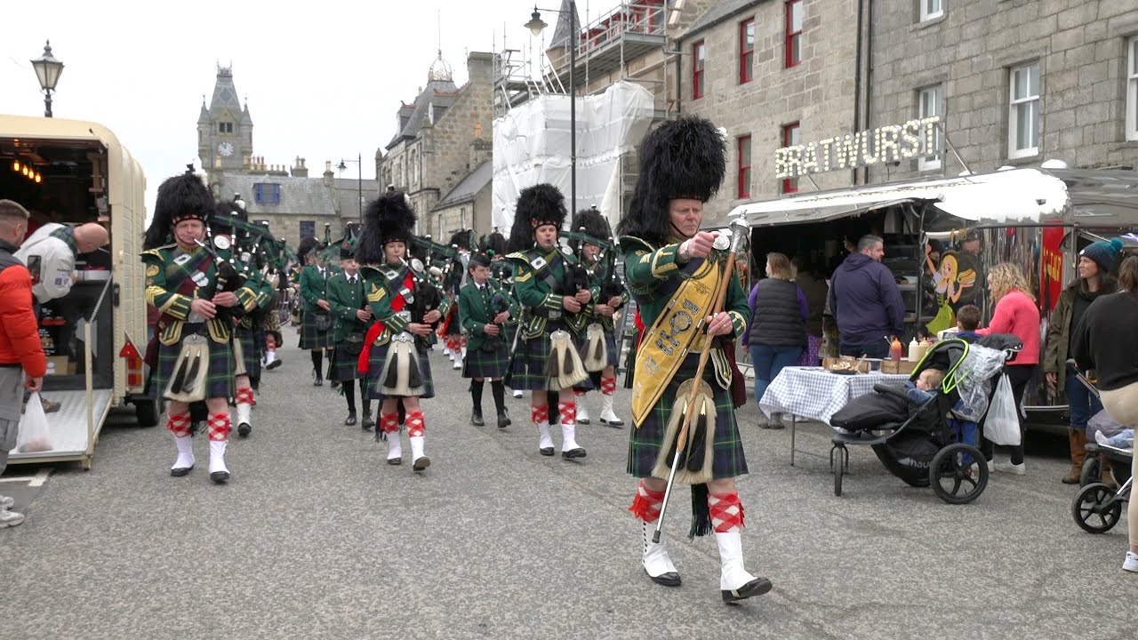 Huntly & District Pipe Band march into Huntly Square as they celebrate 75th anniversary in 2023