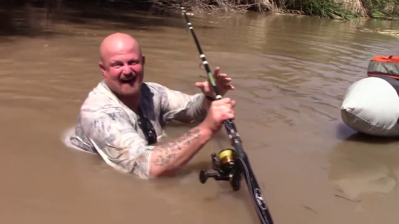 Guy LOSES fishing rod with 40lb CATFISH on the line and DIVES IN after it!
