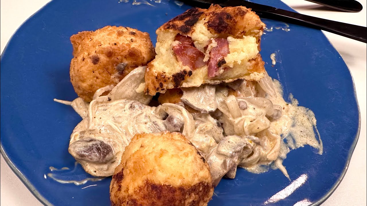 Crispy potato balls with mushroom sauce