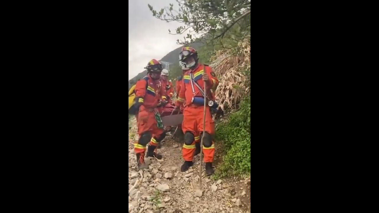 Firefighters rescue trapped earthquake victims