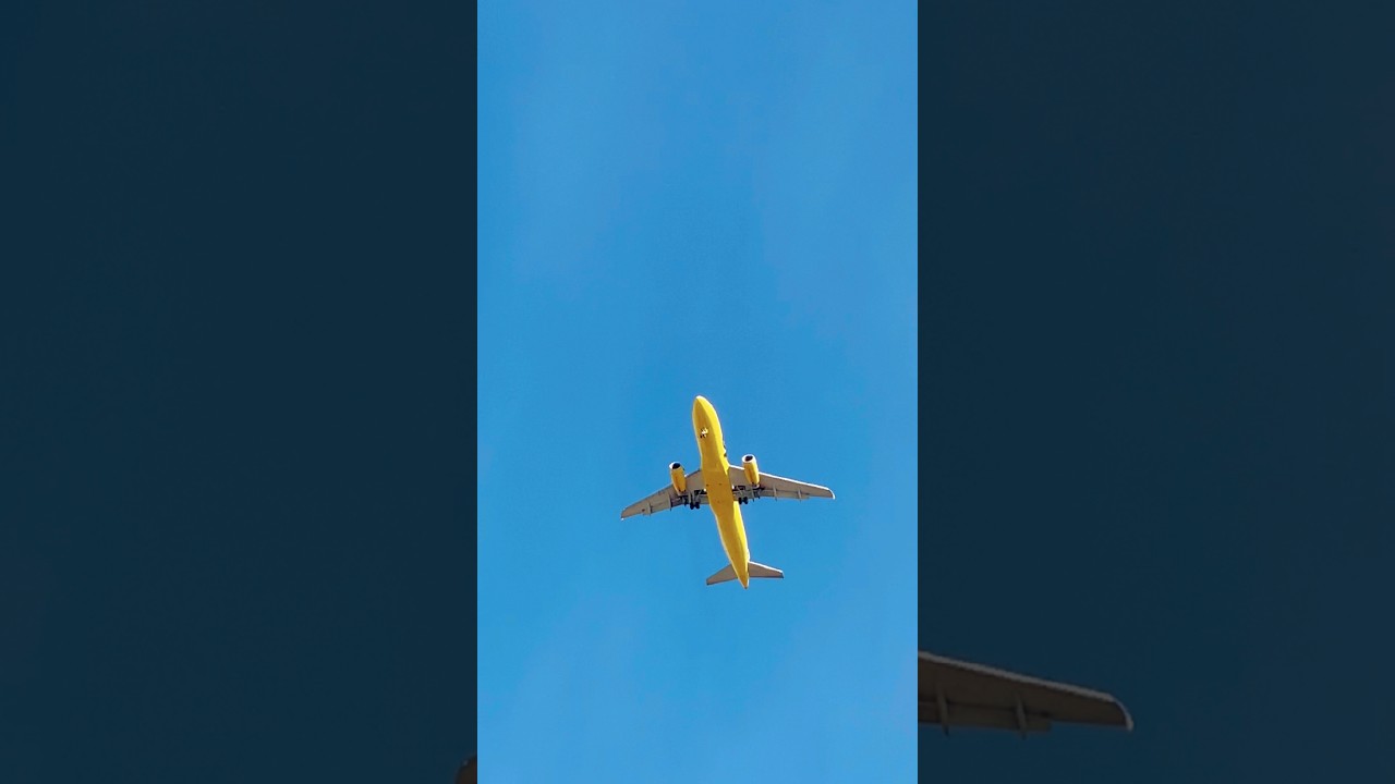 Yellow plane in the sky