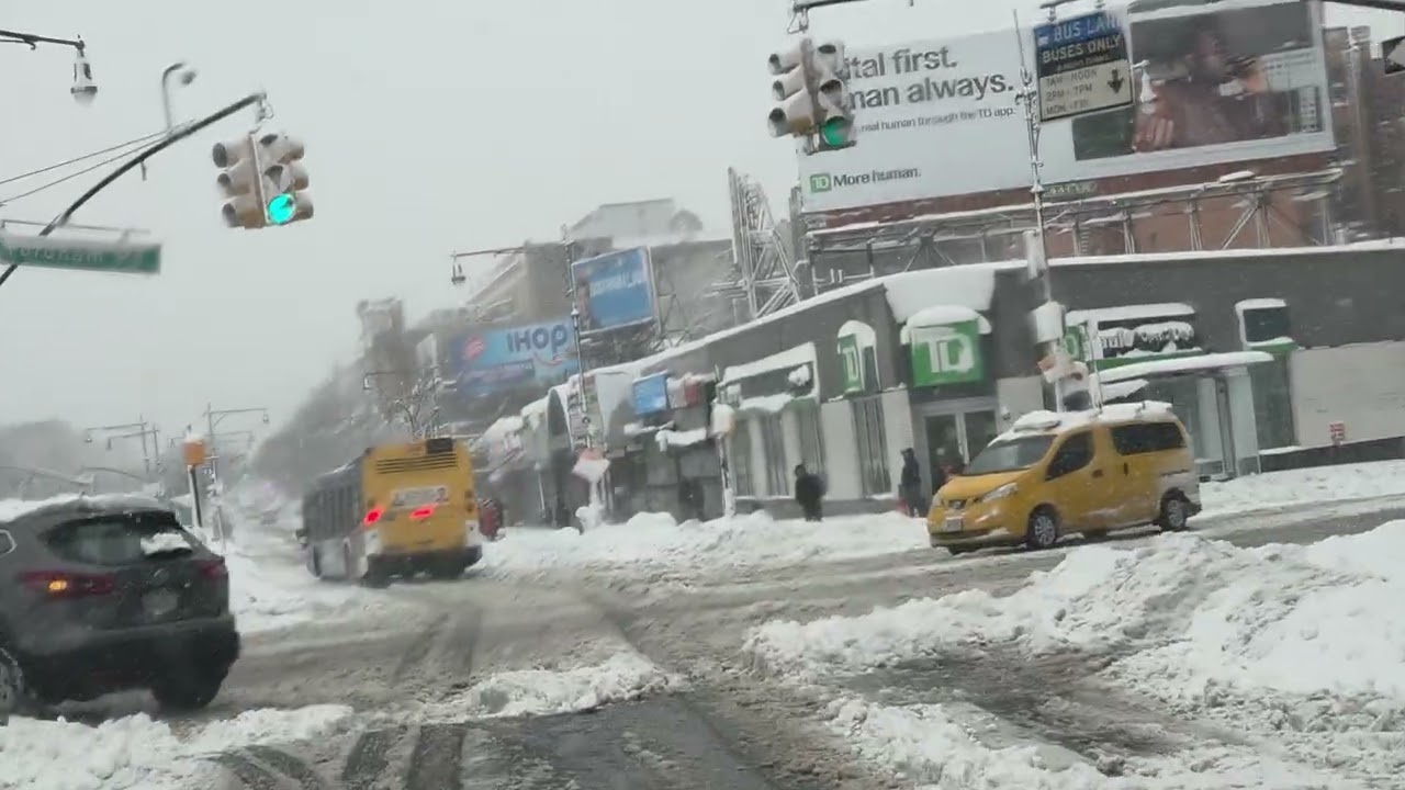 Driving in the Heavy snow storm on Grand concourse in the Bronx New York city America 