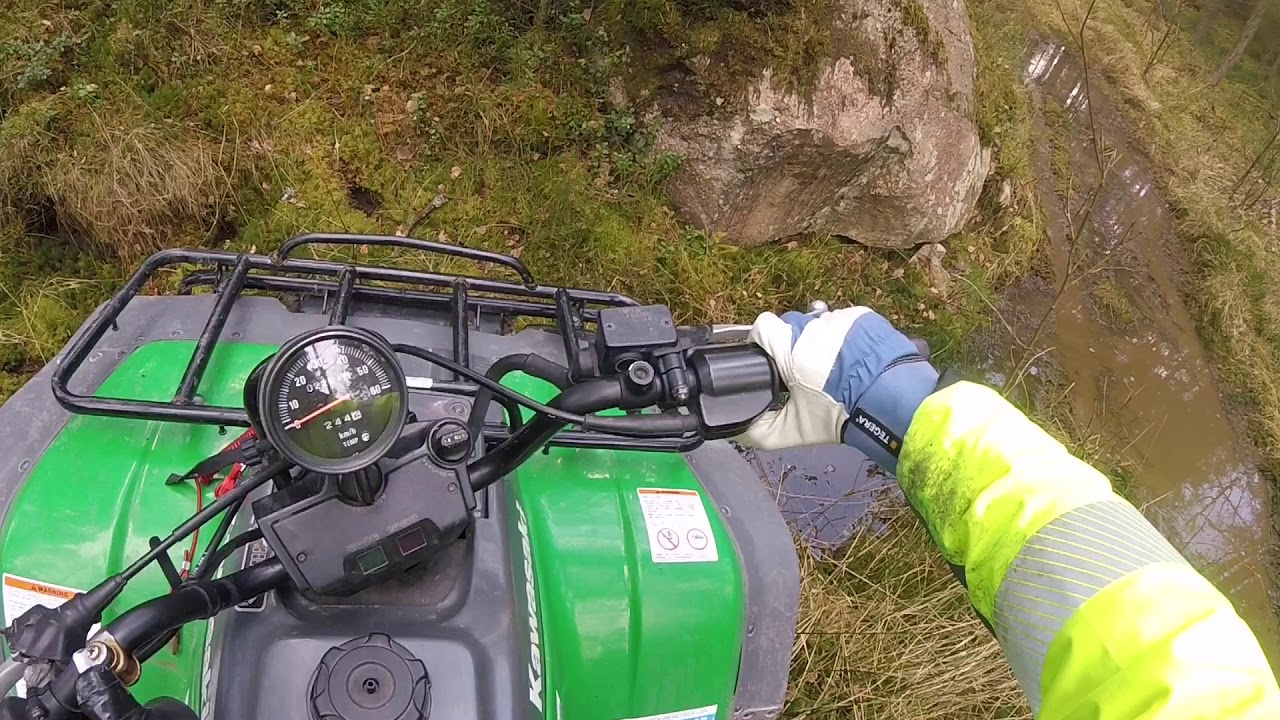 Kawasaki KLF 400 In Muddy And Difficult Terrain