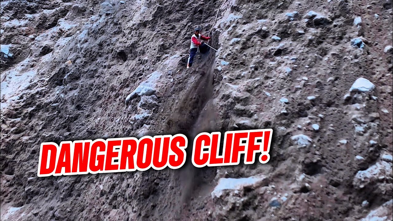 Extreme Job! Man Hanging on a Dangerous Cliff Without Machines