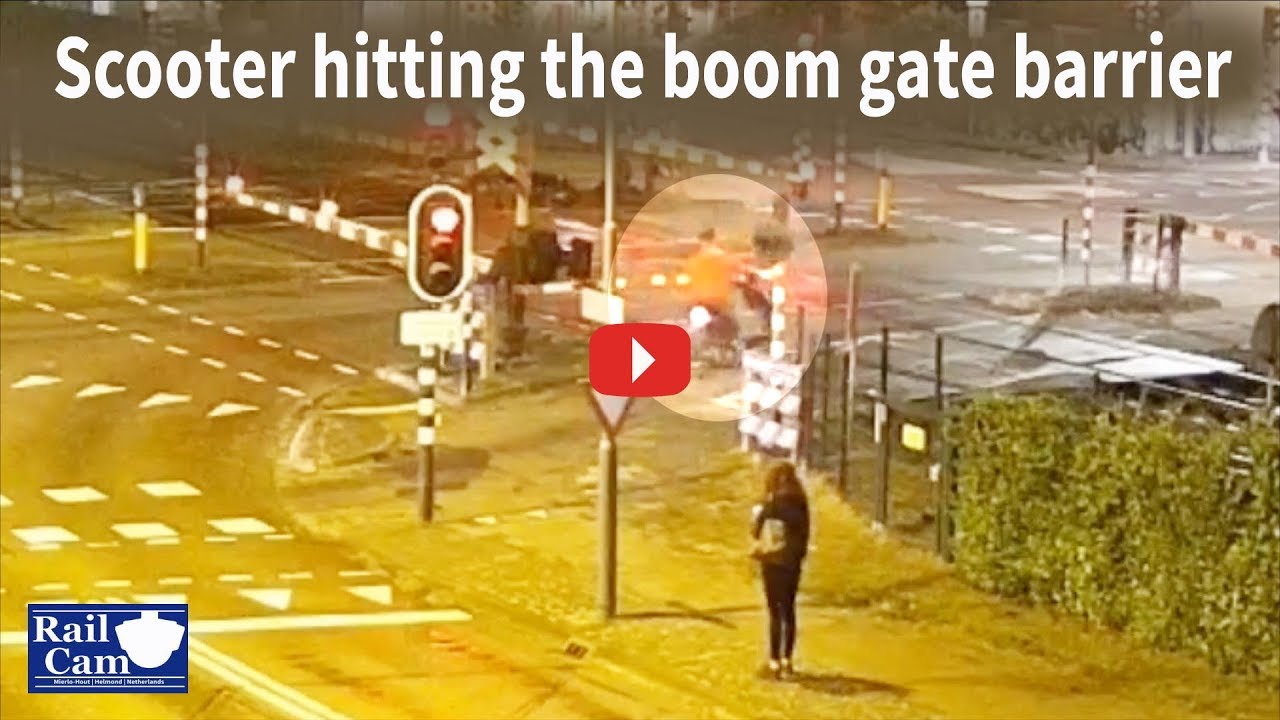 Scooter hitting boom gate barrier on RailCam crossing