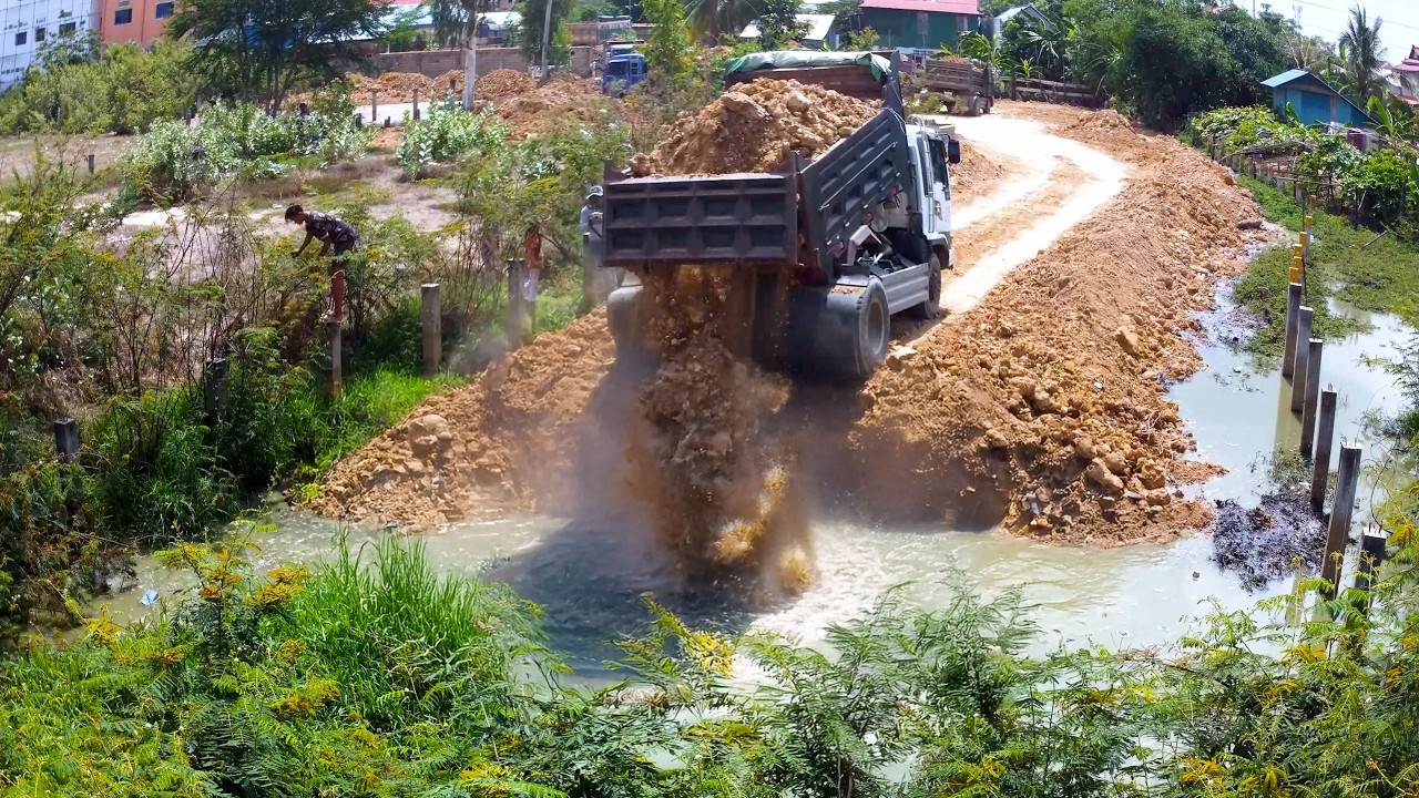 The big pond unload by BULLDOZER WITH DUMP TRUCK FULL PROJECT